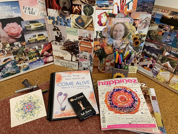 Photo of vision boards, magazines, mantra cards and equipment